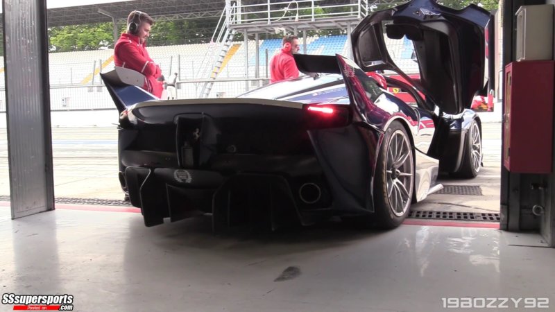 2-dark-blue-laferrari-fxx-k-rear-side-view-door-up-monza-paddock